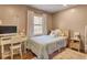 Bright bedroom features patterned wallpaper, filled with natural light and a desk at 210 Peters St, Summerville, SC 29483