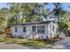 Exterior of a white painted brick house with well-maintained landscaping at 210 Peters St, Summerville, SC 29483