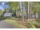 Charming single-story home with a well-maintained lawn, landscaping, and ample parking at 210 Peters St, Summerville, SC 29483