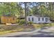 Exterior of a white house with a shed on a well-maintained property at 210 Peters St, Summerville, SC 29483