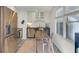 Cozy eat-in kitchen featuring stainless steel appliances, dark counters, and decorative tile floor at 210 Peters St, Summerville, SC 29483