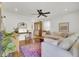 Inviting living room with a stylish area rug, hardwood flooring, and white sofa at 210 Peters St, Summerville, SC 29483
