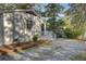 Back exterior of home with white siding and a white gravel driveway at 210 Peters St, Summerville, SC 29483
