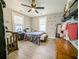 Bedroom features two windows, a ceiling fan, and ample closet space at 2125 Victory Ave, North Charleston, SC 29405