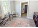 Small dining area with table and chairs features a view of the entryway and a vintage rug at 2125 Victory Ave, North Charleston, SC 29405