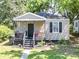 Charming one-story home with inviting porch and well-maintained landscaping at 2125 Victory Ave, North Charleston, SC 29405