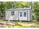 Backyard shed with double doors and a window, offering extra storage space at 2125 Victory Ave, North Charleston, SC 29405