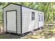 Exterior view of the backyard storage shed with a single door and double doors at 2125 Victory Ave, North Charleston, SC 29405