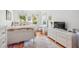 Bright bedroom featuring hardwood floors, white furniture, and natural light at 22 Frogmore Rd, Mount Pleasant, SC 29464