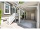Covered parking area featuring a concrete floor, white trim, and access to the home at 22 Frogmore Rd, Mount Pleasant, SC 29464