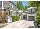 Exterior of the home featuring neutral siding, a covered parking area, and lush landscaping at 22 Frogmore Rd, Mount Pleasant, SC 29464