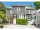 Charming gray two-story home with white trim, a well-maintained lawn, and a concrete driveway at 22 Frogmore Rd, Mount Pleasant, SC 29464