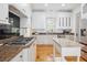Well-lit kitchen featuring granite countertops, stainless steel appliances, and a kitchen island at 22 Frogmore Rd, Mount Pleasant, SC 29464