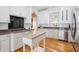 Well-equipped kitchen featuring white cabinets, stainless steel appliances, and stone countertops at 22 Frogmore Rd, Mount Pleasant, SC 29464
