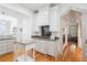 Bright kitchen featuring white cabinetry, granite countertops, and a gas range at 22 Frogmore Rd, Mount Pleasant, SC 29464