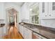Bright kitchen with granite countertops, stainless steel appliances, and view into adjacent room at 22 Frogmore Rd, Mount Pleasant, SC 29464