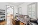 Cozy living room featuring natural light, stylish decor, and a comfortable sofa at 22 Frogmore Rd, Mount Pleasant, SC 29464