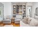 Comfortable living room featuring built-in shelving and comfortable seating at 22 Frogmore Rd, Mount Pleasant, SC 29464