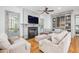 Cozy living room with fireplace, built-in shelving, and comfortable seating at 22 Frogmore Rd, Mount Pleasant, SC 29464