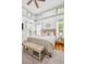 Beautiful main bedroom features natural light, wooden floors and a ceiling fan at 22 Frogmore Rd, Mount Pleasant, SC 29464