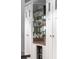 Custom cabinets featuring wine storage, mirrored backsplash, and a wine cooler at 22 Frogmore Rd, Mount Pleasant, SC 29464