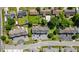 An aerial view shows a townhouse complex with assigned parking and partial tree coverage at 259 Pine Shadow Dr, Goose Creek, SC 29445
