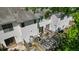 A backyard of a townhouse displays a private patio with a wood fence and a sliding glass door at 259 Pine Shadow Dr, Goose Creek, SC 29445