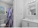 Bathroom featuring a vanity with a white cabinet, a framed mirror, and a shower with purple curtain at 259 Pine Shadow Dr, Goose Creek, SC 29445