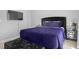This bedroom features a sleek, modern design with a television and plush bedding, creating a comfortable retreat at 259 Pine Shadow Dr, Goose Creek, SC 29445