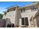 View of the exterior of this home with a sliding glass door and fenced-in yard at 259 Pine Shadow Dr, Goose Creek, SC 29445