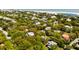Scenic aerial shot showing beautiful homes nestled among mature trees near the coast at 2808 Ion Ave, Sullivans Island, SC 29482