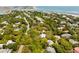 Picturesque aerial view of a coastal neighborhood with homes nestled among mature trees, near the ocean at 2808 Ion Ave, Sullivans Island, SC 29482