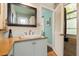 Cozy bathroom featuring a corner sink and an open doorway to the shower at 2808 Ion Ave, Sullivans Island, SC 29482