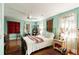 Comfortable bedroom with hardwood floors, a ceiling fan, and lots of decor at 2808 Ion Ave, Sullivans Island, SC 29482