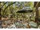 Relaxing deck area featuring outdoor seating and a picturesque view of the surrounding trees at 2808 Ion Ave, Sullivans Island, SC 29482