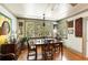 Charming dining room features natural light, hardwood floors, and classic decor at 2808 Ion Ave, Sullivans Island, SC 29482