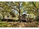 Charming home surrounded by mature trees and natural landscaping at 2808 Ion Ave, Sullivans Island, SC 29482