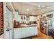 Well-lit kitchen features a farmhouse sink, wood counters, and modern stainless steel refrigerator at 2808 Ion Ave, Sullivans Island, SC 29482