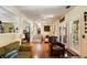 Inviting living room with hardwood floors, comfortable seating, and sunlit windows at 2808 Ion Ave, Sullivans Island, SC 29482