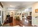Open-concept living room boasts hardwood floors, ceiling fans, and comfortable seating areas at 2808 Ion Ave, Sullivans Island, SC 29482