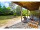 Inviting back porch with comfortable seating and a grill, perfect for enjoying the outdoors at 281 Hawthorne St, Mount Pleasant, SC 29464