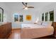 Bright bedroom with hardwood floors and a ceiling fan at 281 Hawthorne St, Mount Pleasant, SC 29464