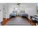 Bright bedroom featuring two twin beds, hardwood floors, and a ceiling fan at 281 Hawthorne St, Mount Pleasant, SC 29464