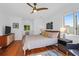 Sunny bedroom featuring wood floors, a ceiling fan, and natural light at 281 Hawthorne St, Mount Pleasant, SC 29464