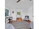 Well-lit bedroom with hardwood floors, desk, and a view of lush greenery at 281 Hawthorne St, Mount Pleasant, SC 29464