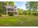 Charming multi-story home with large yard, screened porch, and outdoor space for relaxing and entertaining at 281 Hawthorne St, Mount Pleasant, SC 29464