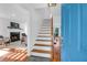 Bright foyer featuring hardwood floors, white walls and a view to the living room with fireplace at 281 Hawthorne St, Mount Pleasant, SC 29464