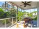 Screened-in porch with a ceiling fan and a table and chairs at 281 Hawthorne St, Mount Pleasant, SC 29464