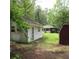 Exterior view of sheds in a spacious backyard, perfect for storage or a workshop, with lots of nature at 298 Summerset Ln, Summerville, SC 29483