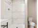 Contemporary bathroom featuring tiled walk-in shower, modern fixtures, and adjacent toilet at 298 Summerset Ln, Summerville, SC 29483